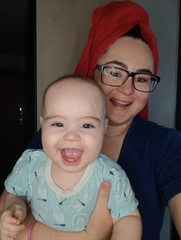 Mother and baby share quiet moments in Noviy home