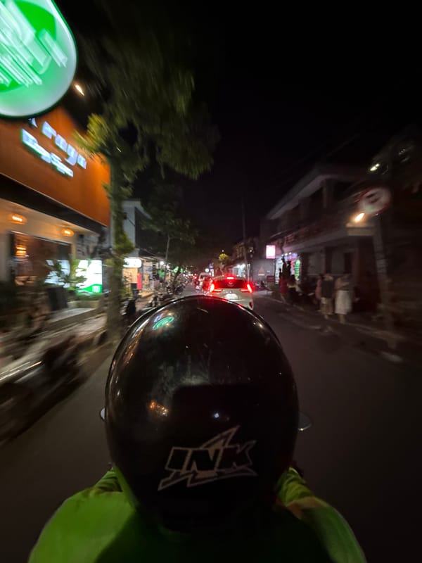 Motorcycle rider captures nighttime journey through Ubud District