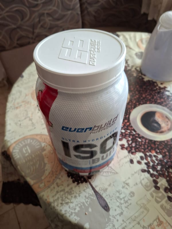 Protein powder container spotted on coffee-themed table in Gabrovo