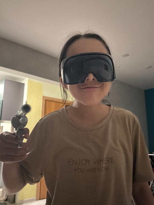 Person in sunglasses with glass pipe observed resting indoors