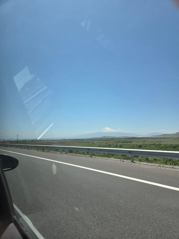 Clear morning view of Armenian countryside captured from vehicle