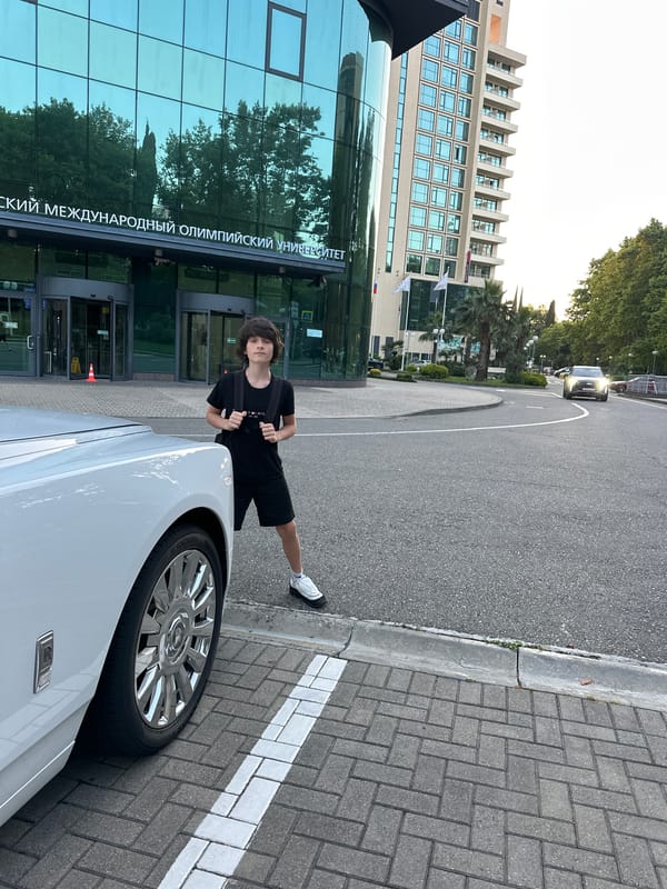 Sochi evening: sunset, seafront dining, and a white Rolls-Royce