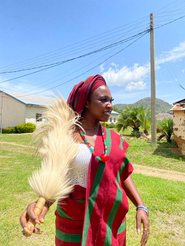 Traditional gathering in Wang, Nigeria with matching ceremonial dress