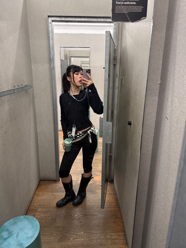 Woman takes fitting room selfie in London store