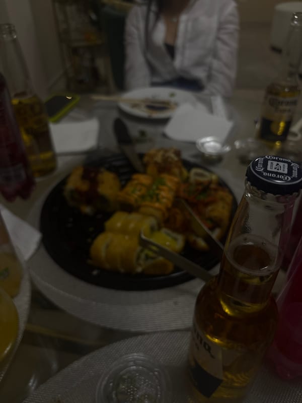 Sushi and Corona beer meal documented in Puebla