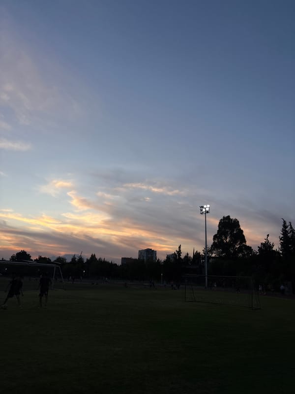 Late-night runner captured on athletic track in Puebla twilight