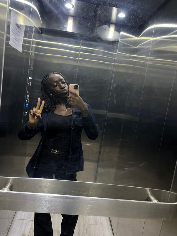 Woman takes elevator selfies in Karum, Nigeria
