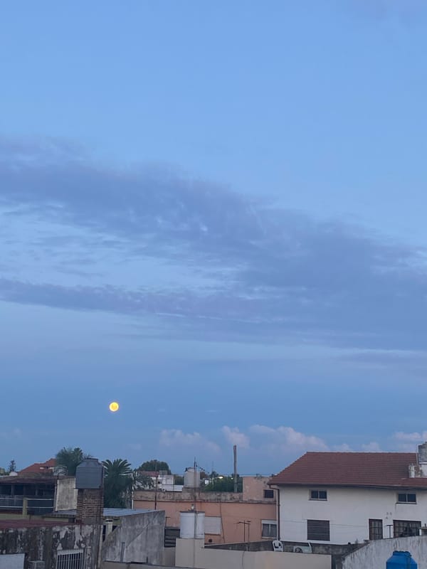 Full moon and striated clouds observed in Wilde, Argentina