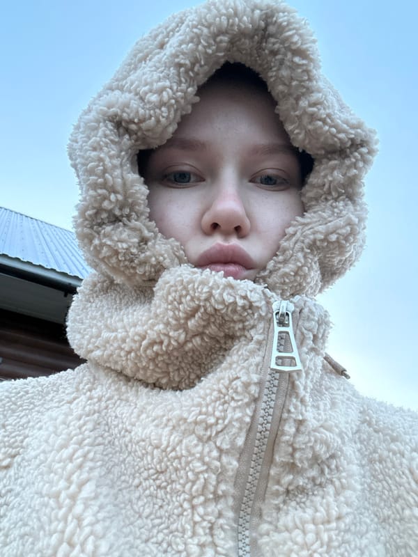 Young person in hooded jacket photographed in Zhigalki, Russia