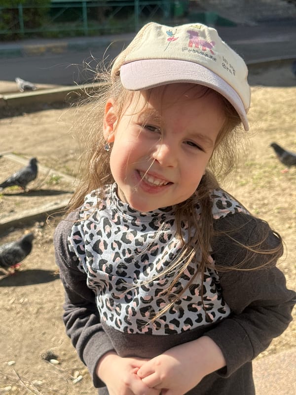Family feeds pigeons, plays at park in Lyubertsy