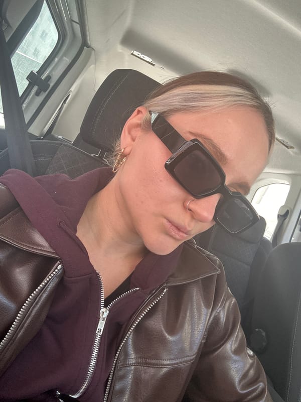 Woman, girl pose for selfie amid street activity in Esenyurt