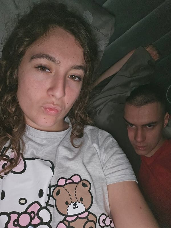 Two people rest on cushioned surface in Sofia