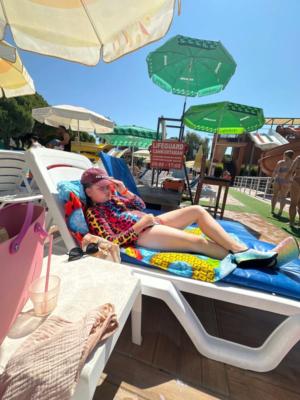 Summer day at an Alanya water park, pool full and sun out.