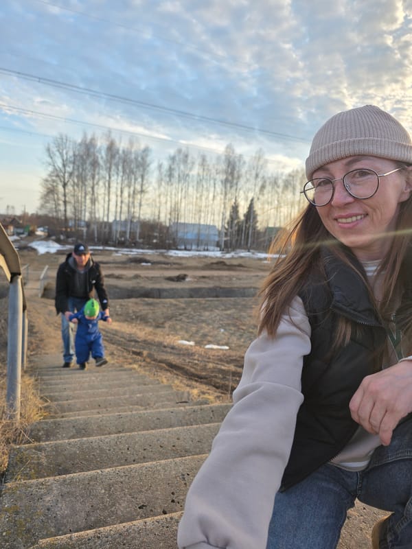 Family outing captured at monument and stairs in Noviy
