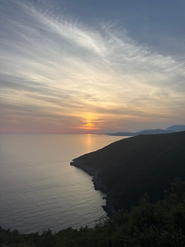 Adriatic sunset framed through hands and glasses, Zagora