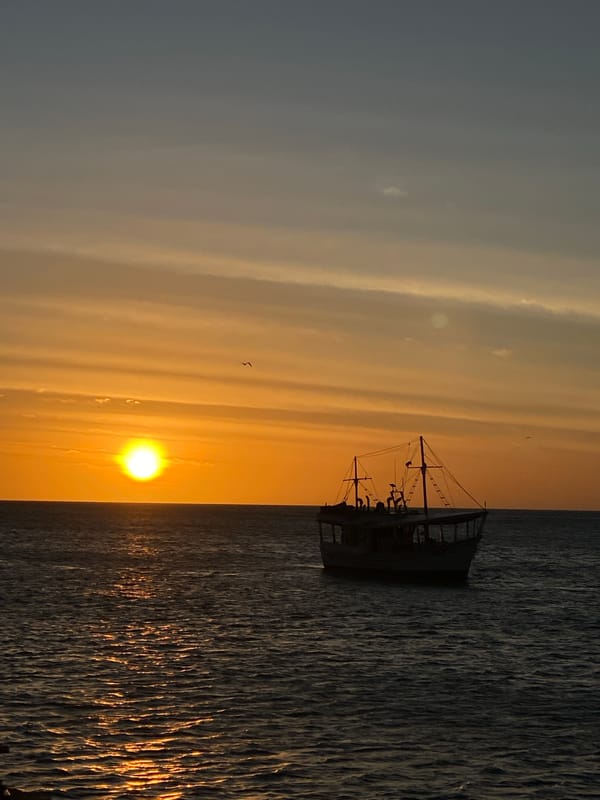 Crowds gather for sunset viewing at Juan Griego waterfront
