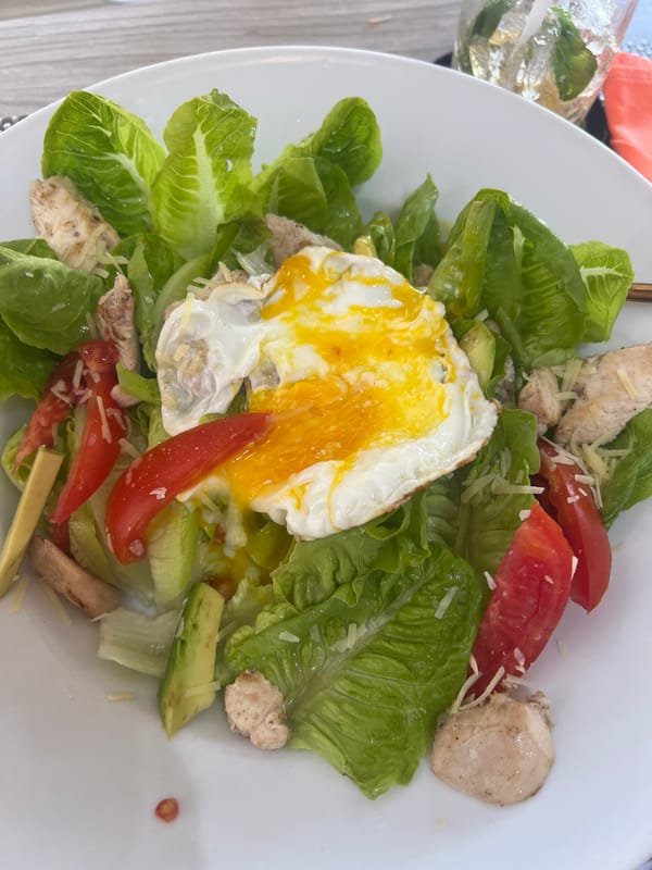 Caesar salad and iced coffee at a Sukawati café