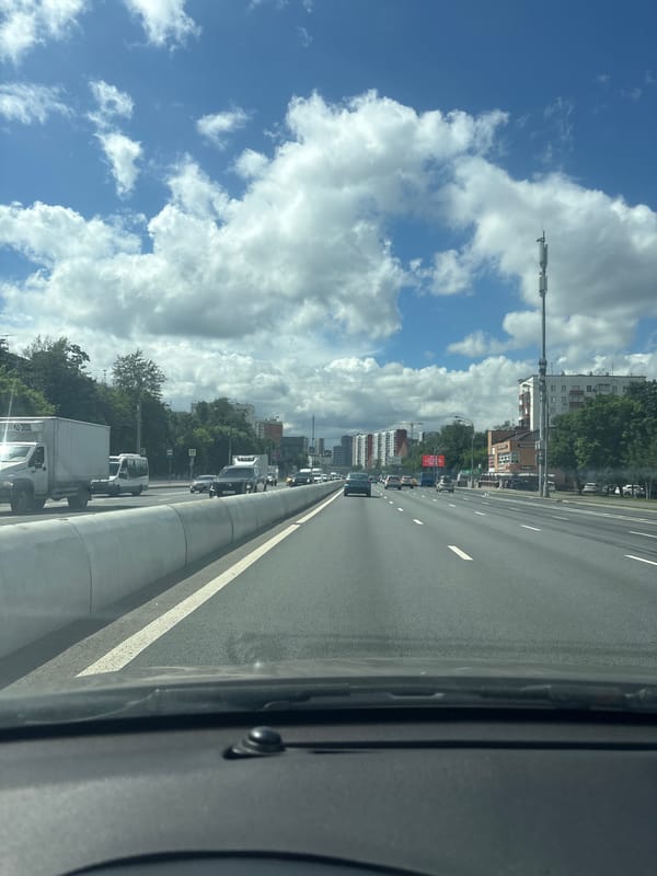Highway traffic on a Moscow road, shot from inside a vehicle.