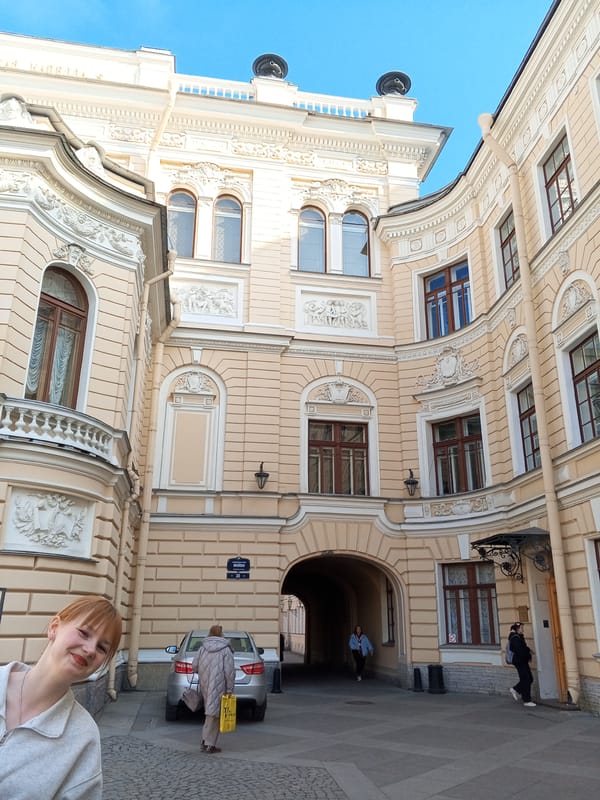 Saint Petersburg scenes: ornate architecture and young women