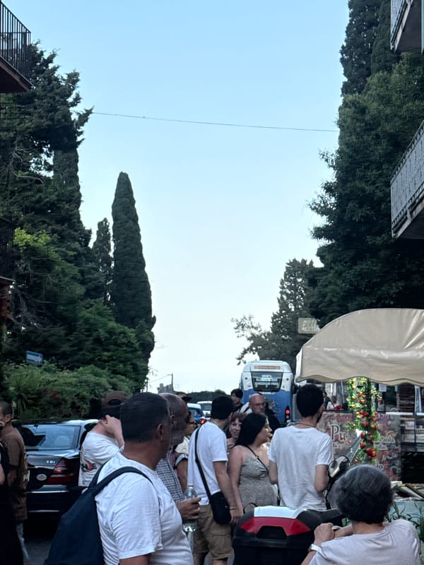 Clear evening skies documented in Taormina street scene