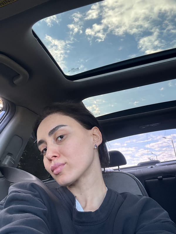 Person photographed in car with open sunroof in Tbilisi
