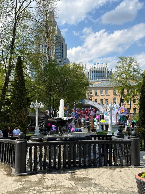 Moscow park view features prominent Yota building backdrop
