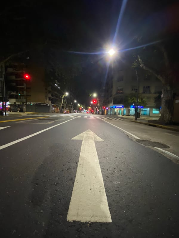 Man stands on Buenos Aires crosswalk during nighttime