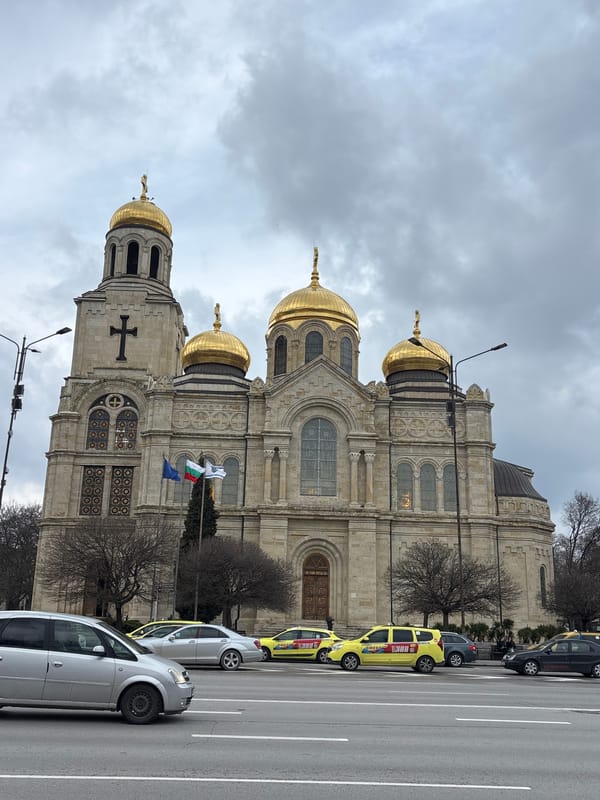 Morning glimpses of cathedral, cat, and cafe in Varna