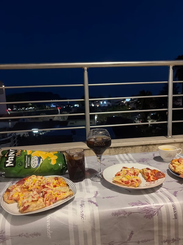 Balcony evening in Budva: pizza, kids, and coastal views
