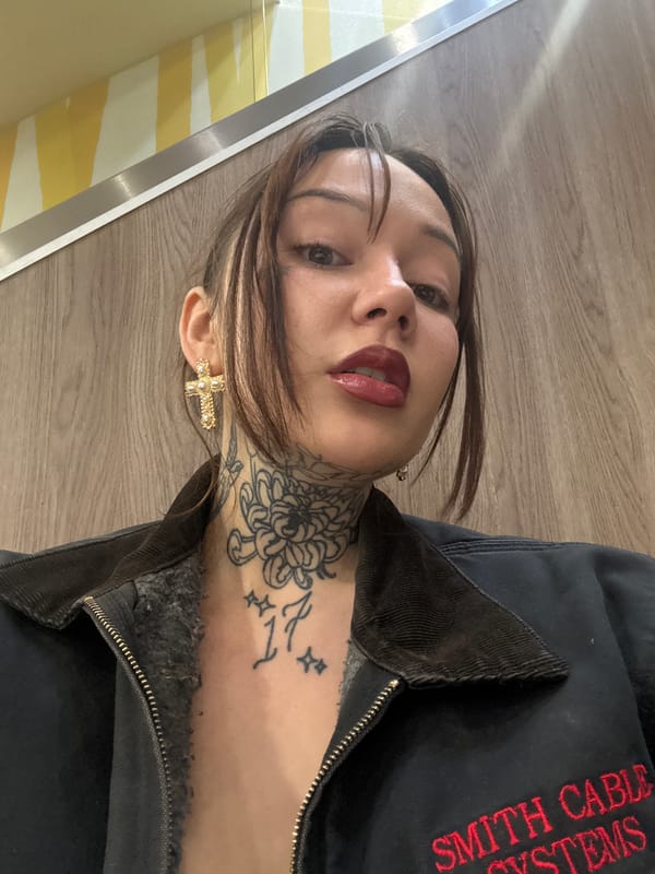 Woman takes high-angle selfie on wooden floor in London