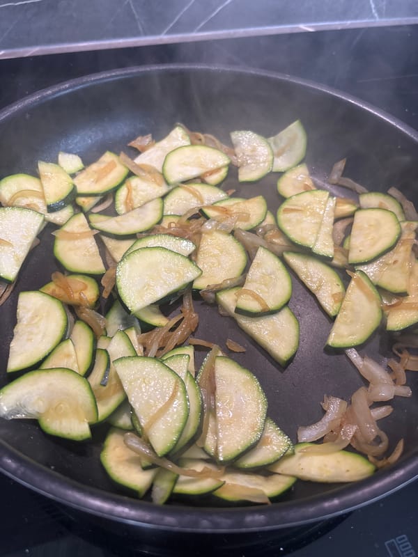 Home cooking session with zucchini and onions in Zagreb