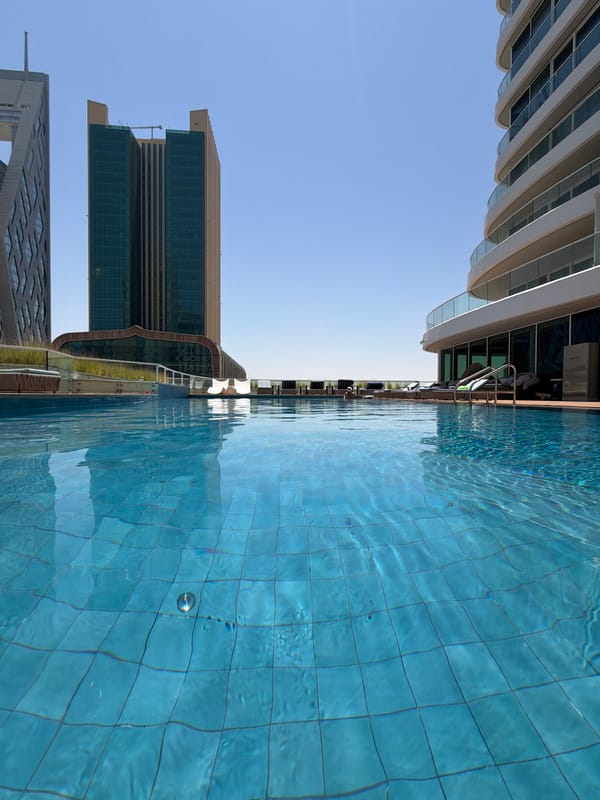 Rooftop pool session in an urban high-rise setting