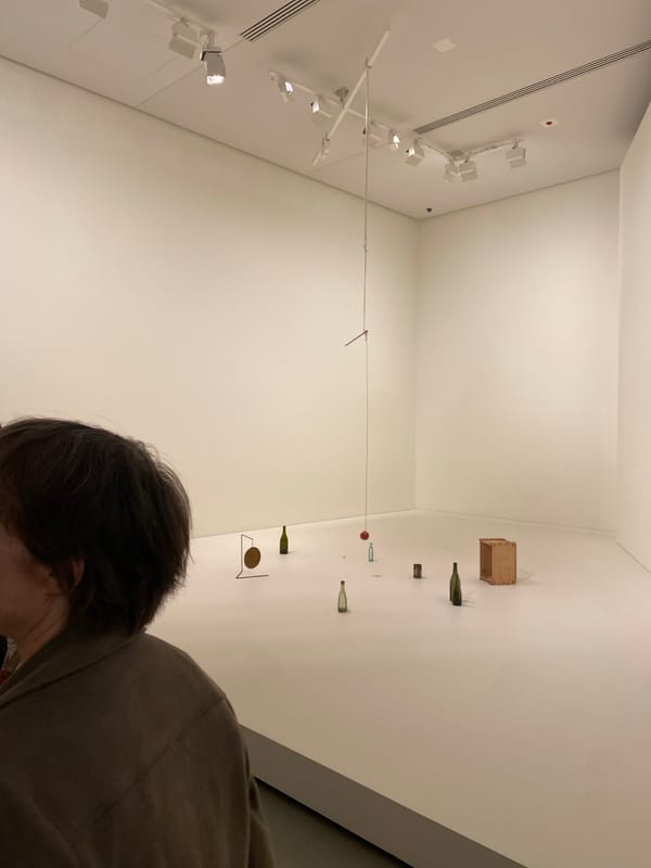 Inside a Paris contemporary art gallery, mid-afternoon