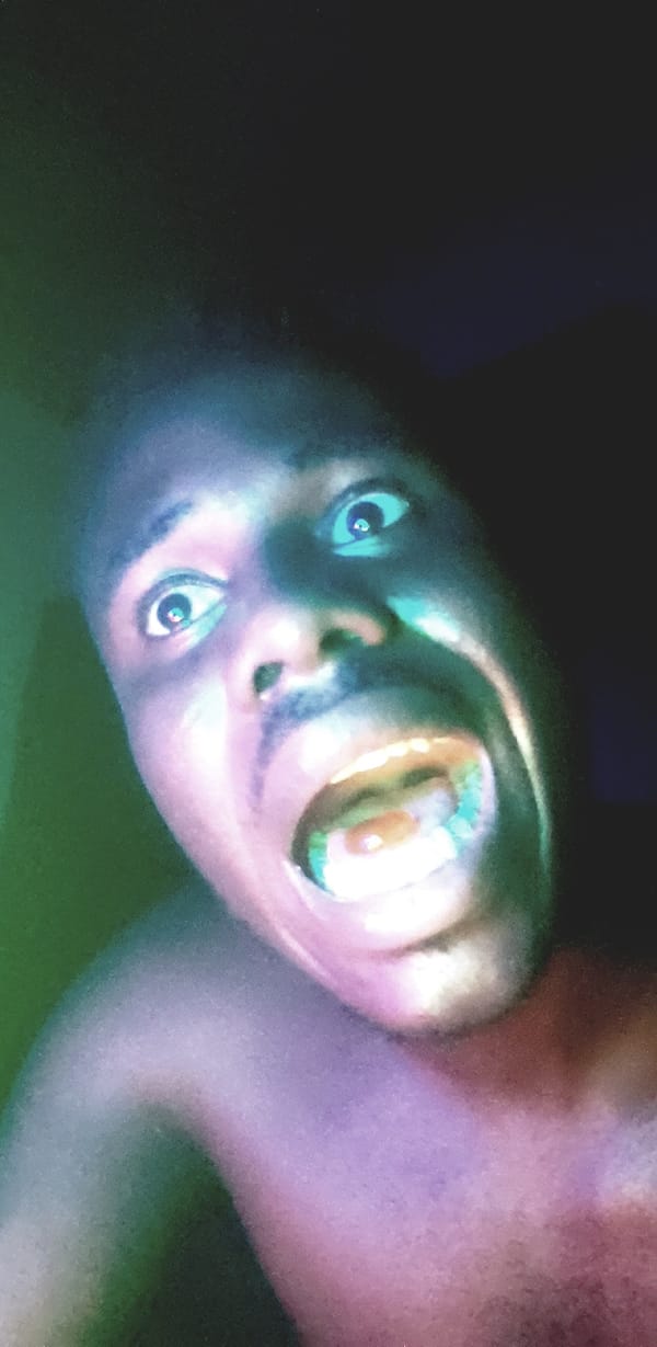 Person photographed under blue lighting in Narayi, Nigeria