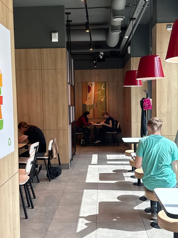 Fast food visit and theatrical building exterior in Izhevsk