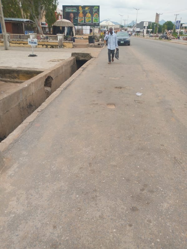 Everyday street activity across Jalingo, Nigeria on a cloudy afternoon