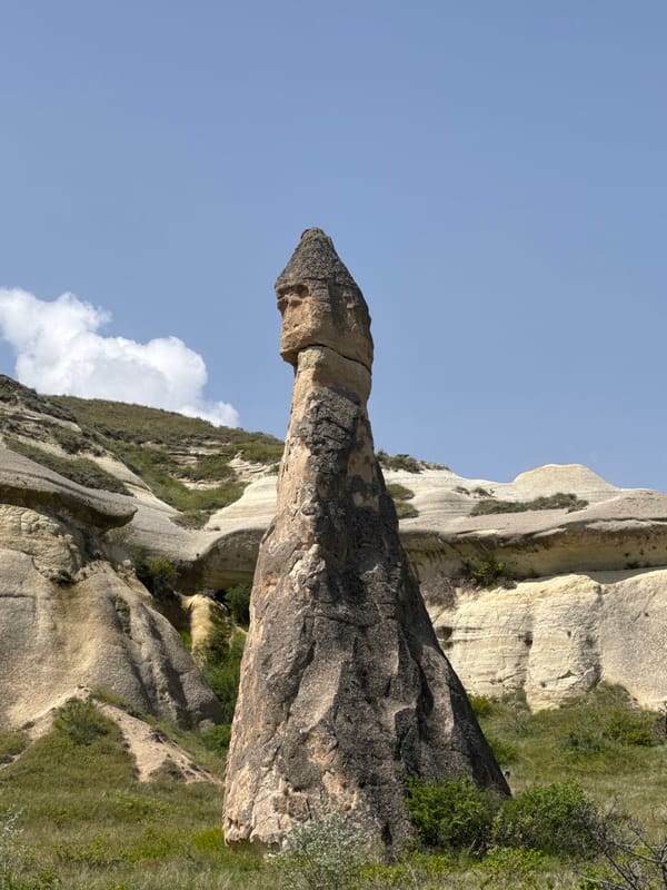 Tourist documents Cappadocia's fairy chimneys in Avanos, Turkey