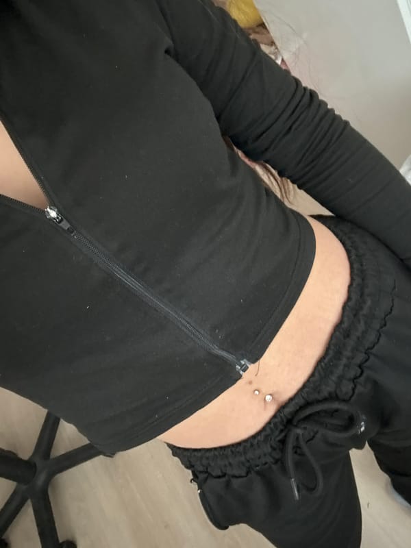 Person photographed twice in Plovdiv wearing black, showing manicured nails