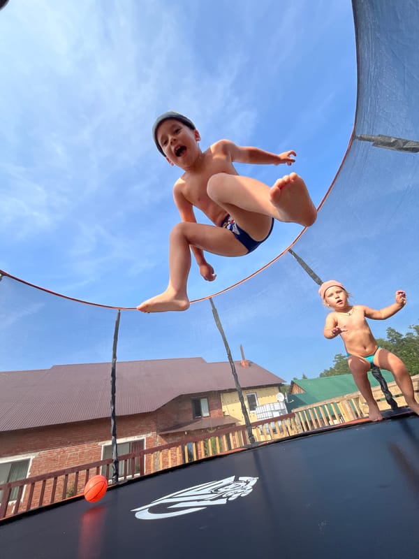 Kids catching air on a trampoline in Chaikovsky