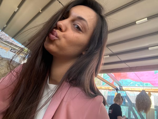 Woman enjoys afternoon drink with decorative setup in Kragujevac