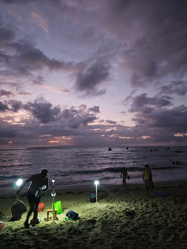 Evening fishing and beach activities documented in Denpasar
