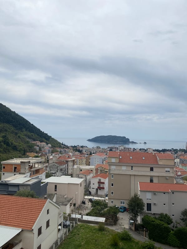 Elevated views captured of Budva's red-roofed coastal cityscape