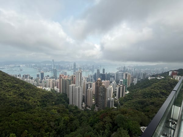 Hong Kong skyline captured from multiple elevated viewpoints under clouds