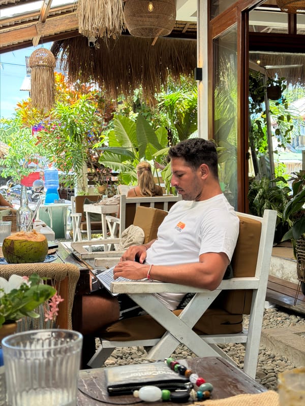 Man dines at outdoor cafe in General Luna, Philippines