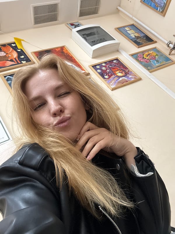 Woman takes selfies indoors in Podosenikha, Russia