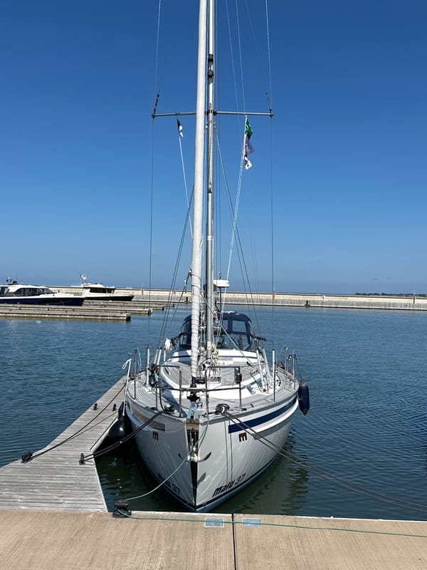 Sailboats and yachts docked at Tallinn marina on a sunny day