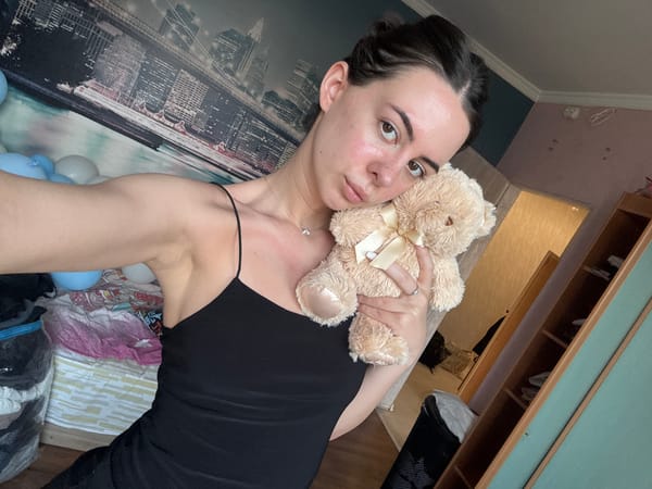 Woman documents personal photo session with teddy bear companion