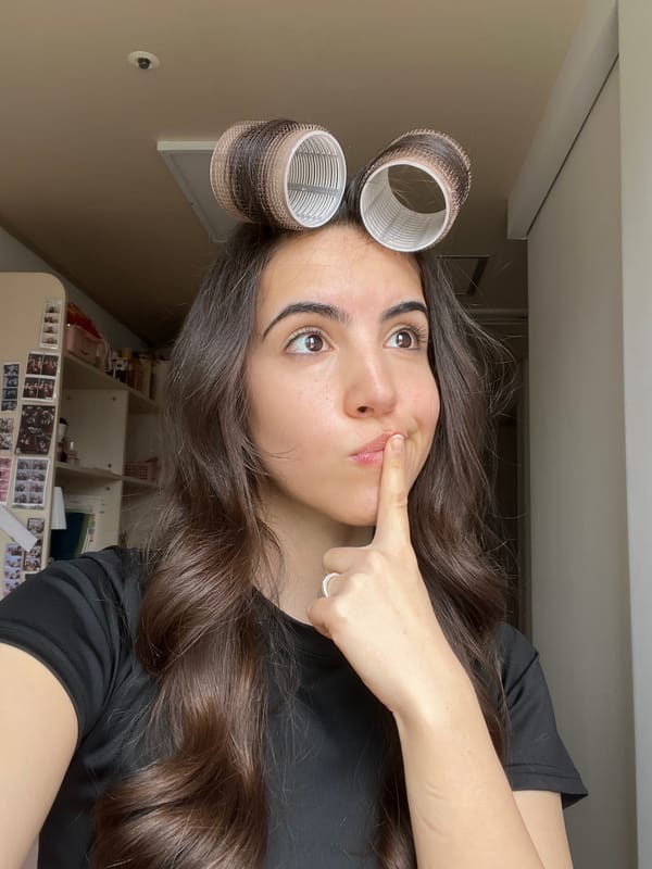 Woman takes late-night selfies with hair rollers in Daegu bedroom