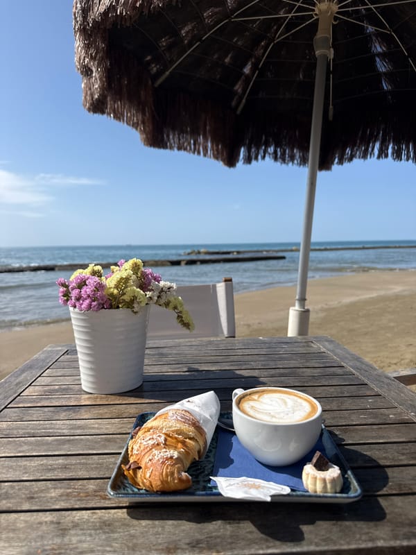 Morning breakfast captured at beachside table in Anzio, Italy