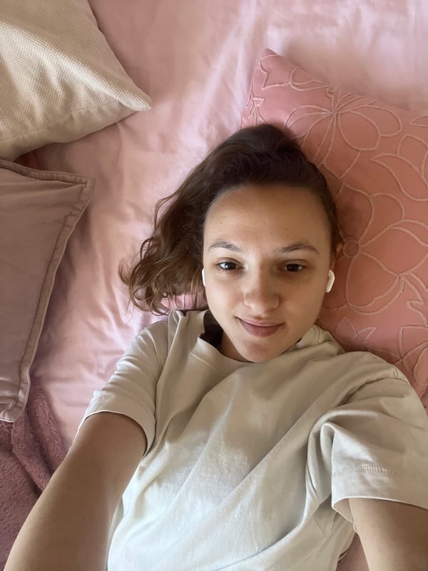 Person moves between indoor bed and outdoor sidewalk in Saarbrücken